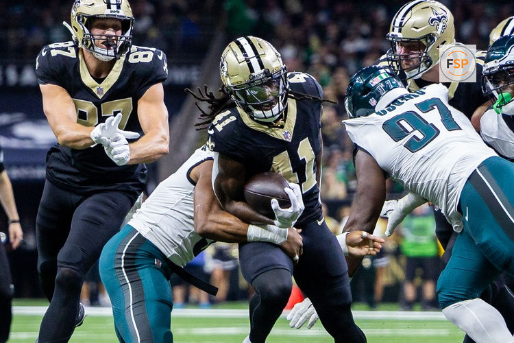 Sep 22, 2024; New Orleans, Louisiana, USA; New Orleans Saints running back Alvin Kamara (41) is tackled by Philadelphia Eagles linebacker Nolan Smith Jr. (3) during the first half at Caesars Superdome. Credit: Stephen Lew-Imagn Images