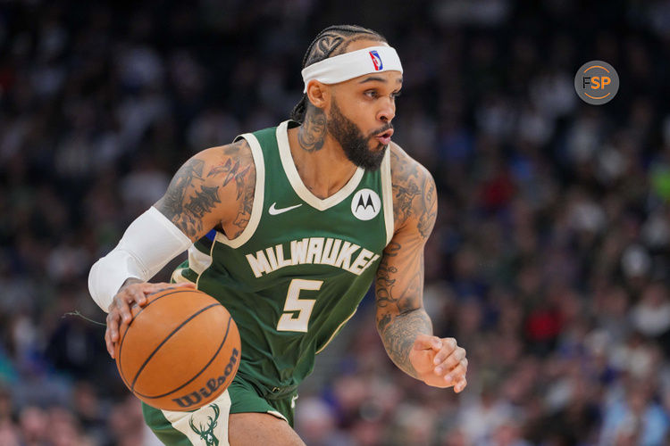 Feb 12, 2025; Minneapolis, Minnesota, USA; Milwaukee Bucks guard Gary Trent Jr. (5) dribbles against the Minnesota Timberwolves in the fourth quarter at Target Center. Credit: Brad Rempel-Imagn Images