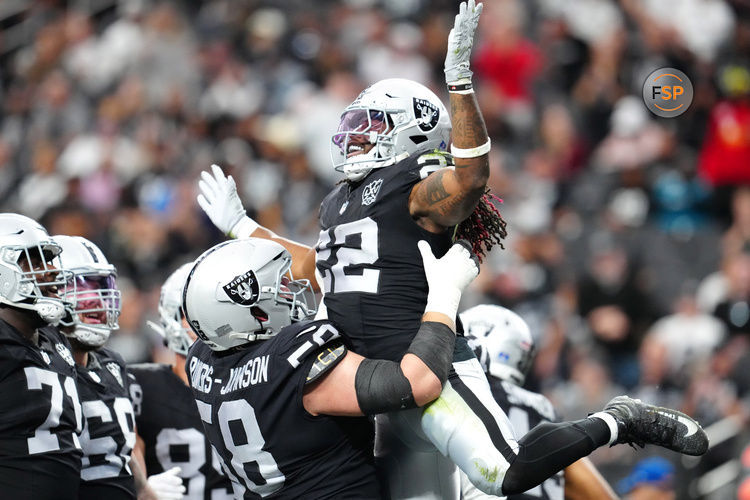 Dec 22, 2024; Paradise, Nevada, USA; Las Vegas Raiders running back Alexander Mattison (22) celebrates with Las Vegas Raiders guard Jackson Powers-Johnson (58) after scoring a touchdown against the Jacksonville Jaguars during the second quarter at Allegiant Stadium. Credit: Stephen R. Sylvanie-Imagn Images