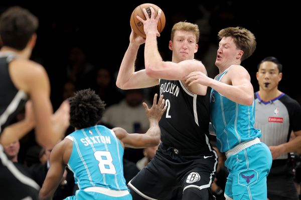 Dec 1, 2025; Brooklyn, New York, USA; Brooklyn Nets forward Danny Wolf (2) looks to pass the ball against Charlotte Hornets guards Kon Knueppel (7) and Collin Sexton (8) during the first quarter at Barclays Center. Mandatory Credit: Brad Penner-Imagn Images