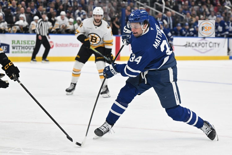 Nov 8, 2025; Toronto, Ontario, CAN;  Toronto Maple Leafs forward Auston Matthews (34) shoots the puck against the Boston Bruins in the third period at Scotiabank Arena. Credit: Dan Hamilton-Imagn Images