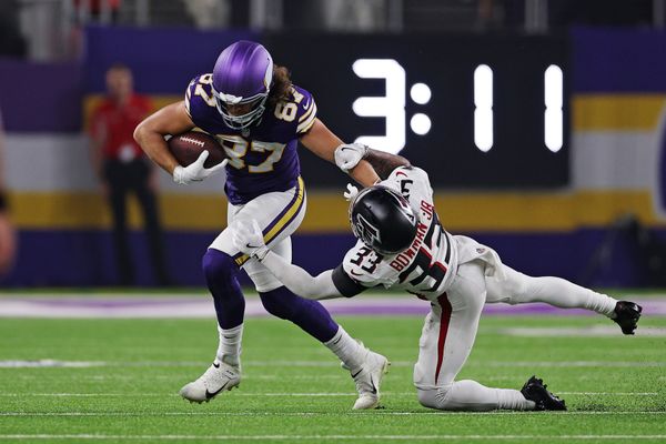 Sep 14, 2025; Minneapolis, Minnesota, USA; Minnesota Vikings tight end T.J. Hockenson (87) runs the ball as Atlanta Falcons safety Billy Bowman Jr. (33) defends during the second half at U.S. Bank Stadium. Mandatory Credit: Matt Krohn-Imagn Images