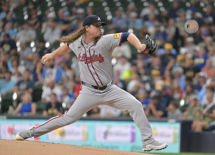 Jul 29, 2024; Milwaukee, Wisconsin, USA; Atlanta Braves starting pitcher Grant Holmes (66) delivers a pitch against the Milwaukee Brewers in the first inning at American Family Field. Mandatory Credit: Michael McLoone-USA TODAY Sports