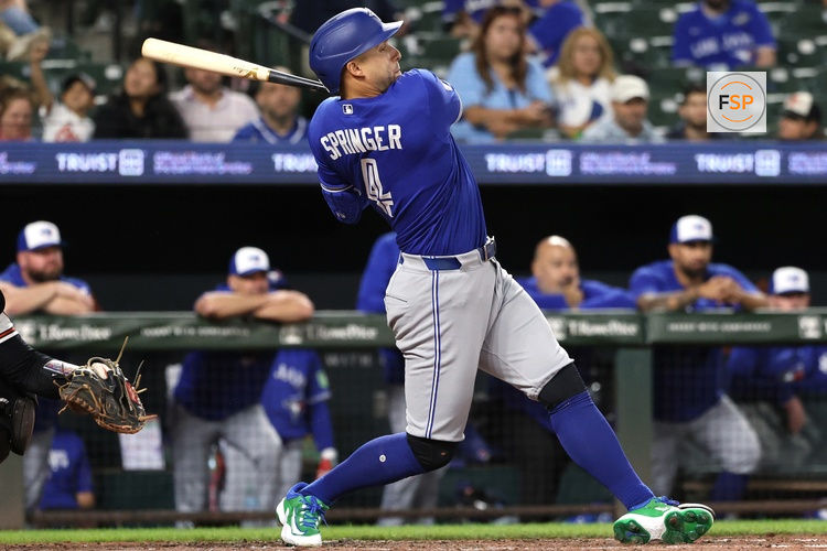 May 27, 2026; Baltimore, Maryland, USA; Toronto Blue Jays designated hitter George Springer (4) hits a double during the eighth inning against the Baltimore Orioles at Oriole Park at Camden Yards. Credit: Daniel Kucin Jr.-Imagn Images