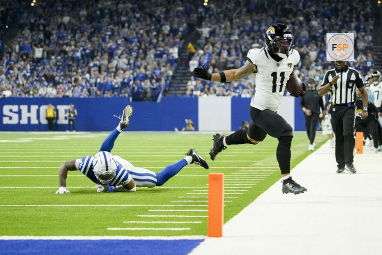 Dec 28, 2025; Indianapolis, Indiana, USA; Jacksonville Jaguars wide receiver Parker Washington (11) runs out of bounds in front of Indianapolis Colts cornerback Cameron Mitchell (43) during a game at Lucas Oil Stadium. Credit: Mykal McEldowney-USA TODAY Network via Imagn Images