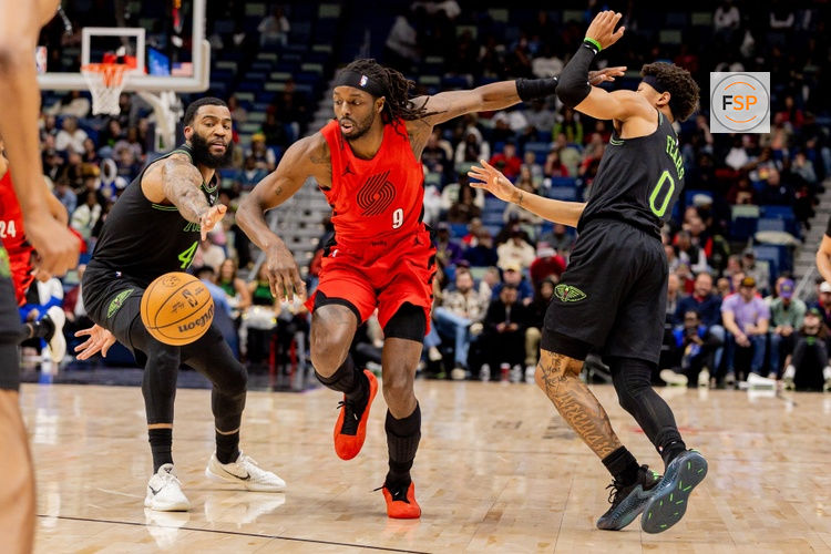 Dec 11, 2025; New Orleans, Louisiana, USA;  Portland Trail Blazers forward Jerami Grant (9) dribbles against New Orleans Pelicans guard/forward Saddiq Bey (41) and guard Jeremiah Fears (0) during the first half at Smoothie King Center. Credit: Stephen Lew-Imagn Images