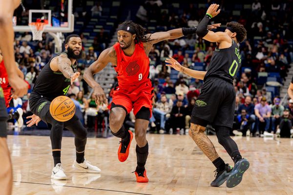 Dec 11, 2025; New Orleans, Louisiana, USA;  Portland Trail Blazers forward Jerami Grant (9) dribbles against New Orleans Pelicans guard/forward Saddiq Bey (41) and guard Jeremiah Fears (0) during the first half at Smoothie King Center. Mandatory Credit: Stephen Lew-Imagn Images