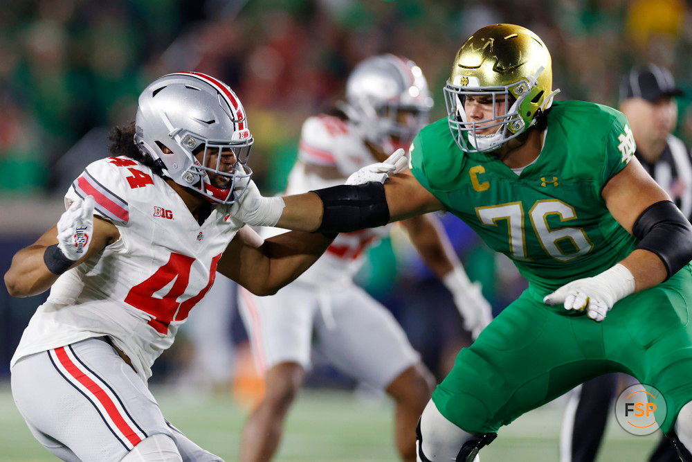 SOUTH BEND, IN - SEPTEMBER 23: Ohio State Buckeyes defensive end JT Tuimoloau (44) rushes against Notre Dame Fighting Irish offensive lineman Joe Alt (76) during a college football game on September 23, 2023 at Notre Dame Stadium in South Bend, Indiana. (Photo by Joe Robbins/Icon Sportswire)