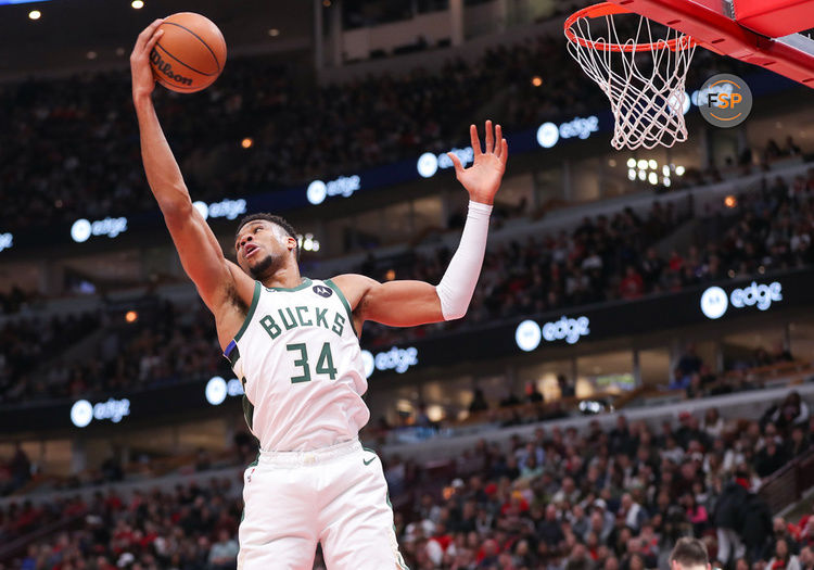 CHICAGO, IL - DECEMBER 28: Milwaukee Bucks Forward Giannis Antetokounmpo (34) grabs the rebound during a NBA game between the Milwaukee  Bucks and the Chicago Bulls on December 28, 2022 at the United Center in Chicago, IL. (Photo by Melissa Tamez/Icon Sportswire)