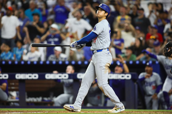 Sep 19, 2024; Miami, Florida, USA; Los Angeles Dodgers designated hitter Shohei Ohtani (17) hits a two-run home run against the Miami Marlins during the seventh inning at loanDepot Park. Mandatory Credit: Sam Navarro-Imagn Images