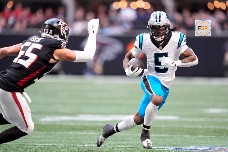 Nov 16, 2025; Atlanta, Georgia, USA;  Carolina Panthers running back Rico Dowdle (5) runs with the ball in the first quarter against the Atlanta Falcons at Mercedes-Benz Stadium. Credit: Dale Zanine-Imagn Images