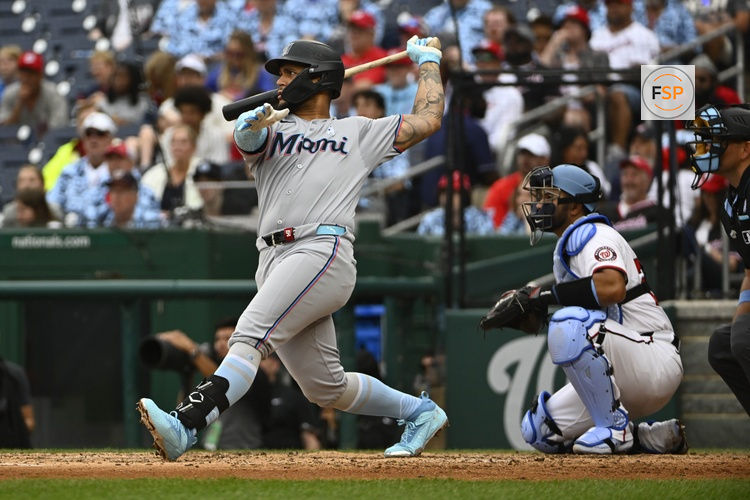 Jun 15, 2025; Washington, District of Columbia, USA; Miami Marlins designated hitter Agustin Ramirez (50) singles against the Washington Nationals during the fifth inning at Nationals Park. Credit: Brad Mills-Imagn Images