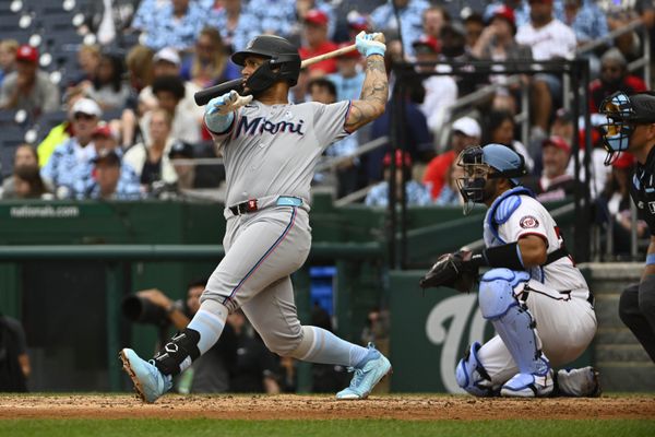 Jun 15, 2025; Washington, District of Columbia, USA; Miami Marlins designated hitter Agustin Ramirez (50) singles against the Washington Nationals during the fifth inning at Nationals Park. Mandatory Credit: Brad Mills-Imagn Images