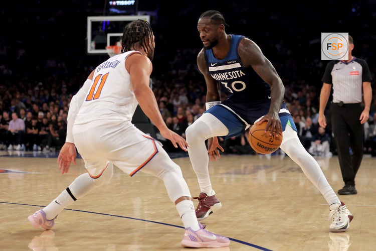 Nov 5, 2025; New York, New York, USA; Minnesota Timberwolves forward Julius Randle (30) controls the ball against New York Knicks guard Jalen Brunson (11) during the first quarter at Madison Square Garden. Credit: Brad Penner-Imagn Images