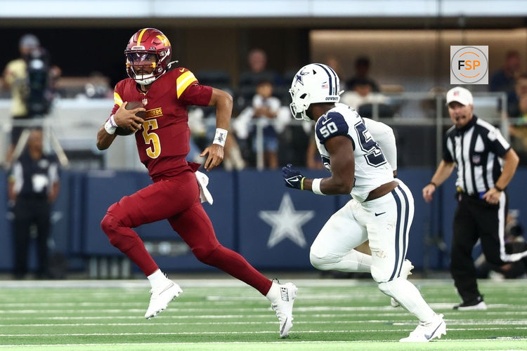 Oct 19, 2025; Arlington, Texas, USA; Washington Commanders quarterback Jayden Daniels (5) scrambles defended by Dallas Cowboys linebacker Shemar James (50) during the second quarter of the game at AT&T Stadium. Credit: Kevin Jairaj-Imagn Images