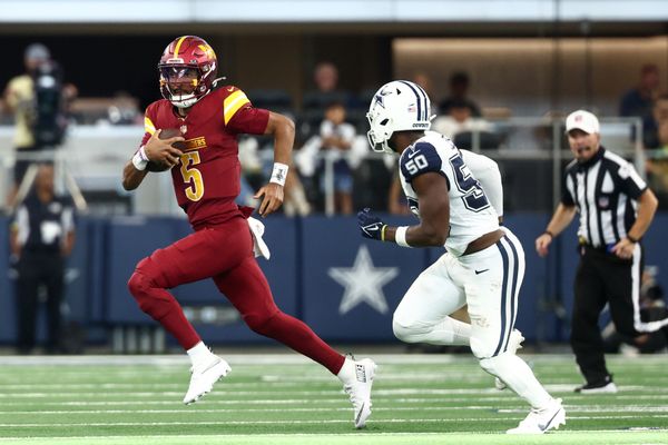 Oct 19, 2025; Arlington, Texas, USA; Washington Commanders quarterback Jayden Daniels (5) scrambles defended by Dallas Cowboys linebacker Shemar James (50) during the second quarter of the game at AT&T Stadium. Mandatory Credit: Kevin Jairaj-Imagn Images