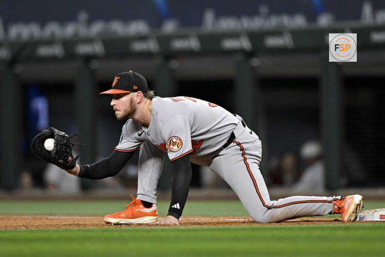 Jul 2, 2025; Arlington, Texas, USA; Baltimore Orioles first baseman Ryan O'Hearn (32) stretches to field a throw to first base during the eighth inning against the Texas Rangers at Globe Life Field. Credit: Jerome Miron-Imagn Images