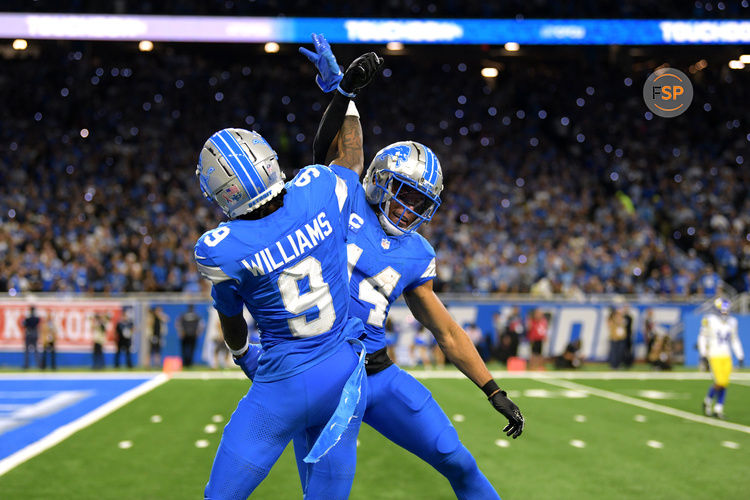 Sep 8, 2024; Detroit, Michigan, USA; Detroit Lions wide receiver Jameson Williams (9) celebrates with wide receiver Amon-Ra St. Brown (14) after catching a touchdown pass against the Los Angeles Rams in the third quarter at Ford Field. Credit: Lon Horwedel-Imagn Images