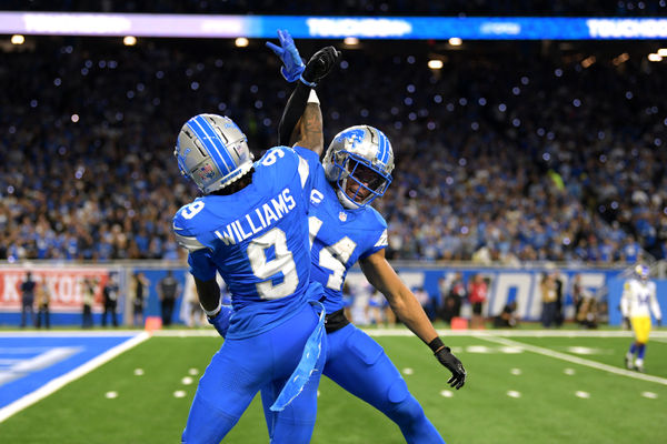 Sep 8, 2024; Detroit, Michigan, USA; Detroit Lions wide receiver Jameson Williams (9) celebrates with wide receiver Amon-Ra St. Brown (14) after catching a touchdown pass against the Los Angeles Rams in the third quarter at Ford Field. Mandatory Credit: Lon Horwedel-Imagn Images