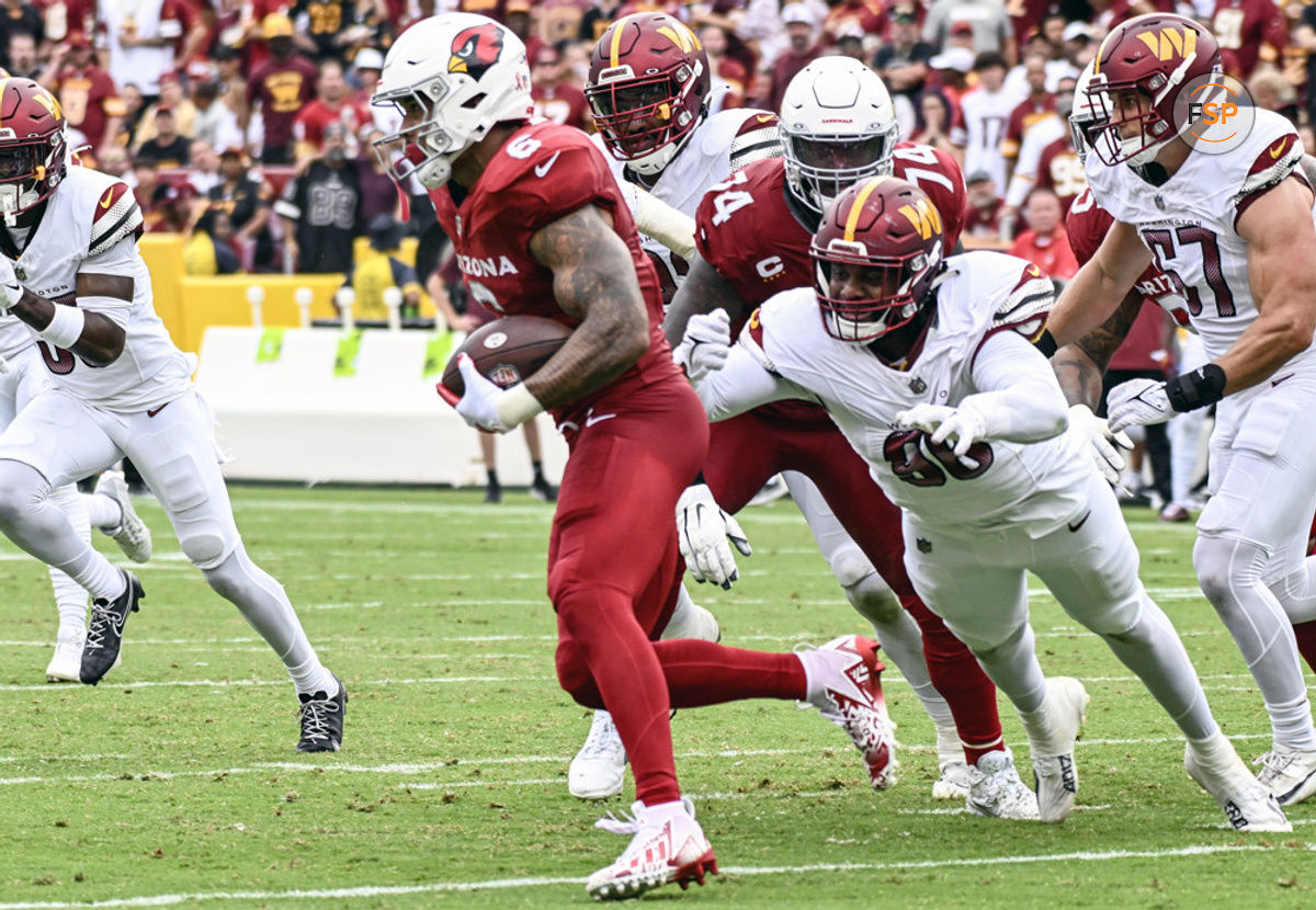 LANDOVER, MD - SEPTEMBER 10: Arizona Cardinals running back James Conner (6) in action against Washington Commanders defensive end Montez Sweat (90) during the NFL game between the Arizona Cardinals and the Washington Commanders on September 10, 2023 at Fed Ex Field in Landover, MD. (Photo by Mark Goldman/Icon Sportswire)