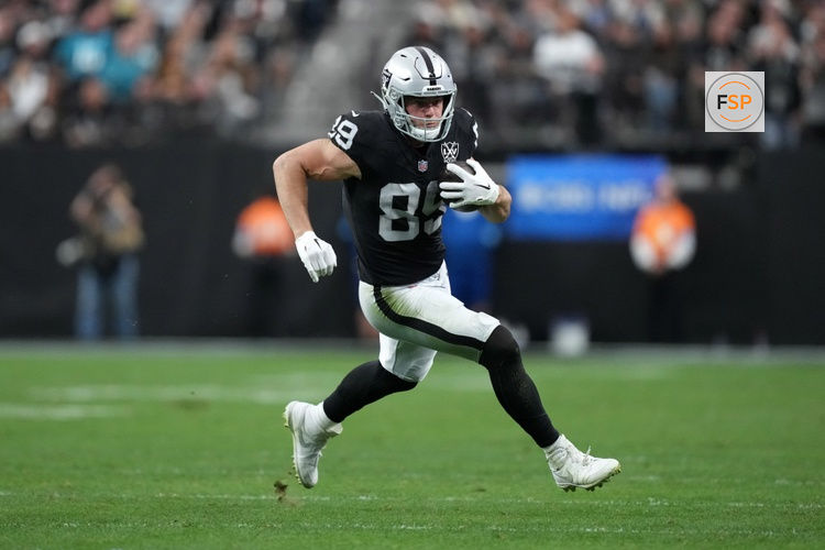 Dec 22, 2024; Paradise, Nevada, USA; Las Vegas Raiders tight end Brock Bowers (89) carries the ball against the Jacksonville Jaguars in the first half at Allegiant Stadium. Credit: Kirby Lee-Imagn Images