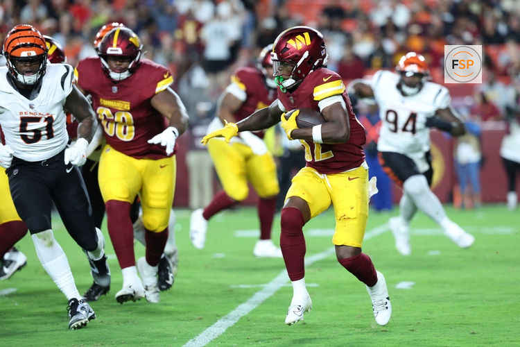 Aug 18, 2025; Landover, Maryland, USA; Washington Commanders running back Jacory Croskey-Merritt (32) carries the ball against the Cincinnati Bengals during the second half at Northwest Stadium. Credit: Amber Searls-Imagn Images