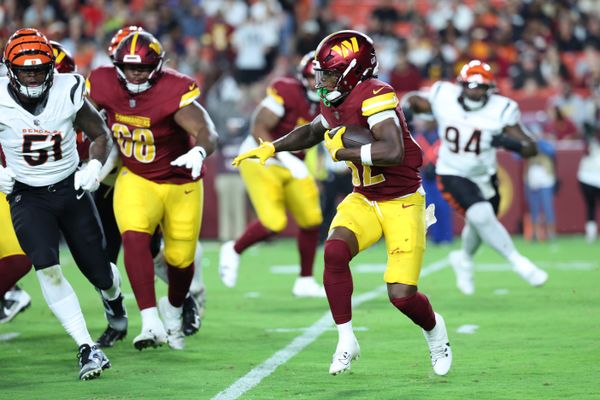Aug 18, 2025; Landover, Maryland, USA; Washington Commanders running back Jacory Croskey-Merritt (32) carries the ball against the Cincinnati Bengals during the second half at Northwest Stadium. Mandatory Credit: Amber Searls-Imagn Images