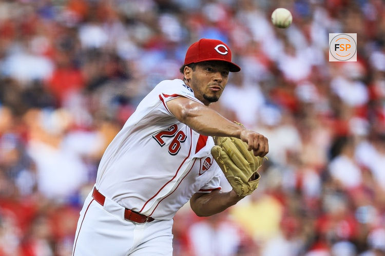 Jun 24, 2025; Cincinnati, Ohio, USA; Cincinnati Reds starting pitcher Chase Burns (26) throws to first in attempt to get New York Yankees third baseman Jazz Chisholm Jr. (not pictured) out in the second inning at Great American Ball Park. Credit: Katie Stratman-Imagn Images