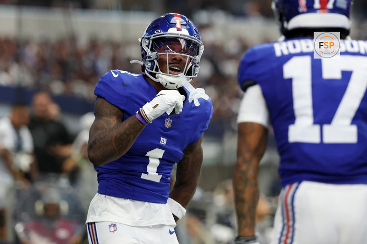Sep 14, 2025; Arlington, Texas, USA; New York Giants wide receiver Malik Nabers (1) celebrates after scoring a touchdown against the Dallas Cowboys during the second quarter at AT&T Stadium. Credit: Kevin Jairaj-Imagn Images