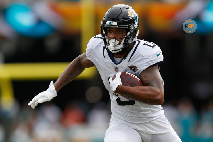 Sep 15, 2024; Jacksonville, Florida, USA; Jacksonville Jaguars wide receiver Gabe Davis (0) runs the ball against the Cleveland Browns during the fourth quarter at EverBank Stadium. Credit: Morgan Tencza-Imagn Images