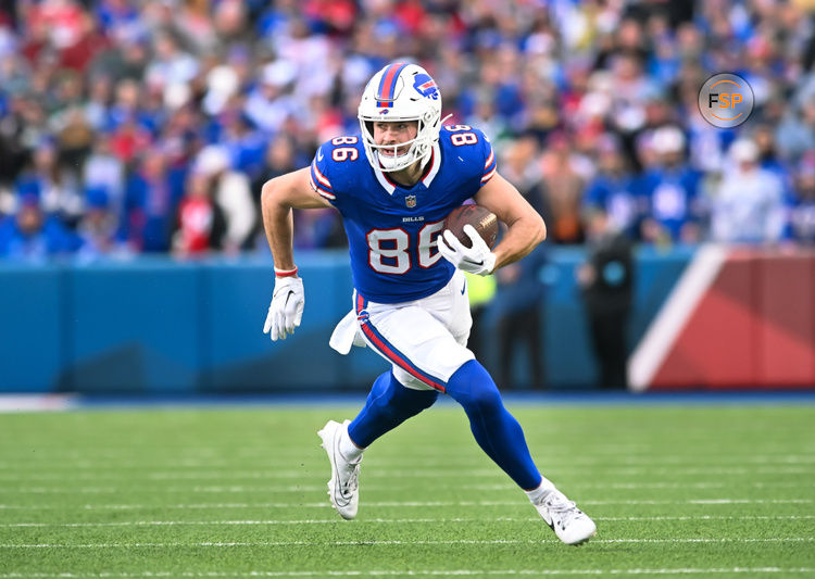 Dec 29, 2024; Orchard Park, New York, USA; Buffalo Bills tight end Dalton Kincaid (86) carries the ball after making a catch in the third quarter against the New York Jets at Highmark Stadium. Credit: Mark Konezny-Imagn Images