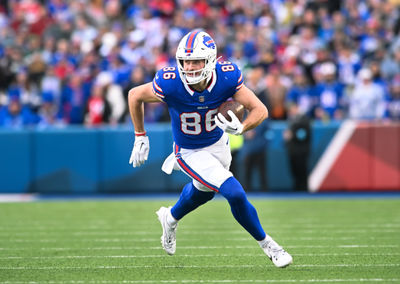 Dec 29, 2024; Orchard Park, New York, USA; Buffalo Bills tight end Dalton Kincaid (86) carries the ball after making a catch in the third quarter against the New York Jets at Highmark Stadium. Mandatory Credit: Mark Konezny-Imagn Images