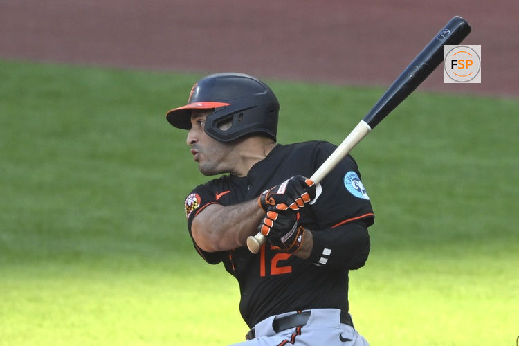 Jul 21, 2025; Cleveland, Ohio, USA; Baltimore Orioles left fielder Ramon Laureano (12) hits a two-RBI single in the first inning against the Cleveland Guardians at Progressive Field. Credit: David Richard-Imagn Images