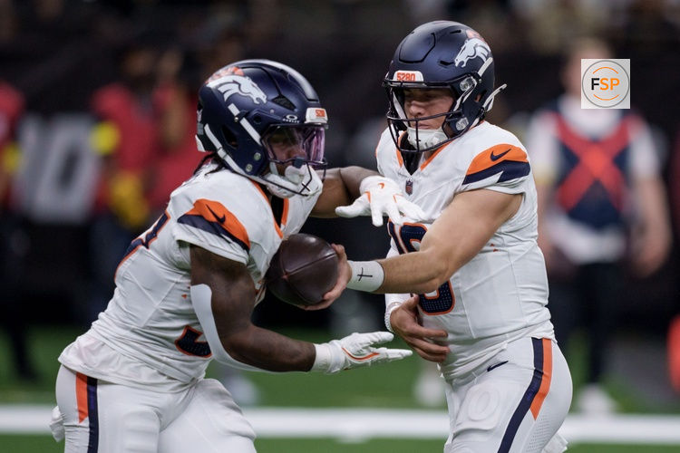 Aug 23, 2025; New Orleans, Louisiana, USA;  Denver Broncos quarterback Bo Nix (10) hands off to Denver Broncos running back RJ Harvey (37) against the New Orleans Saints during the first half at Caesars Superdome. Credit: Matthew Hinton-Imagn Images