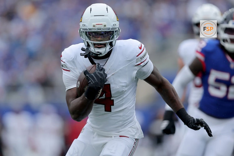 Oct 4, 2026; East Rutherford, New Jersey, USA; Arizona Cardinals running back Jeremiyah Love (4) runs with the ball against the New York Giants during the first quarter at MetLife Stadium. Credit: Brad Penner-Imagn Images