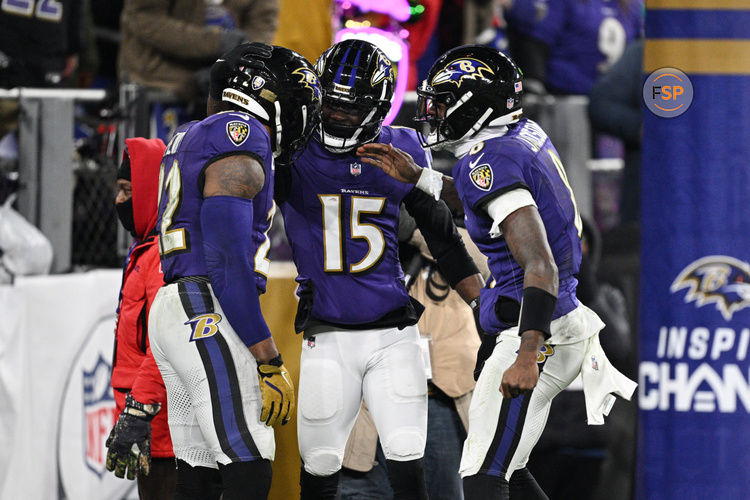 Jan 11, 2025; Baltimore, Maryland, USA; Baltimore Ravens running back Derrick Henry (22) celebrates with wide receiver Nelson Agholor (15) and quarterback Lamar Jackson (8) after scoring a touchdown against the Pittsburgh Steelers in the third quarter in an AFC wild card game at M&T Bank Stadium. Credit: Tommy Gilligan-Imagn Images
