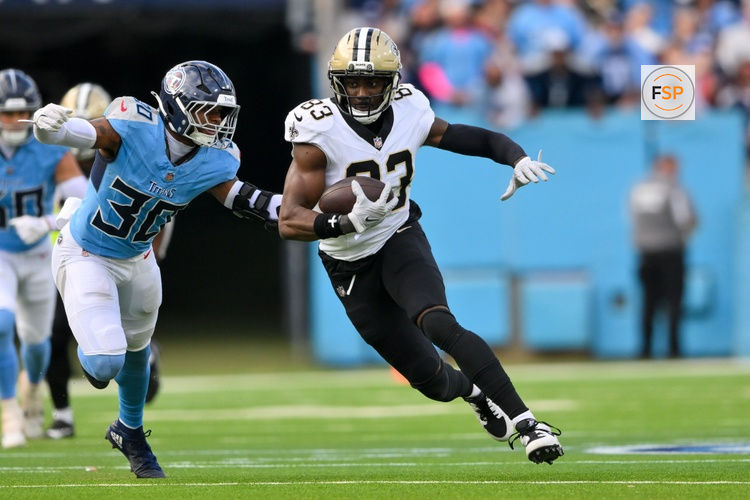 Dec 28, 2025; Nashville, Tennessee, USA;  New Orleans Saints tight end Juwan Johnson (83) runs with the ball after a made catch against the Tennessee Titans during the second half at Nissan Stadium. Credit: Steve Roberts-Imagn Images