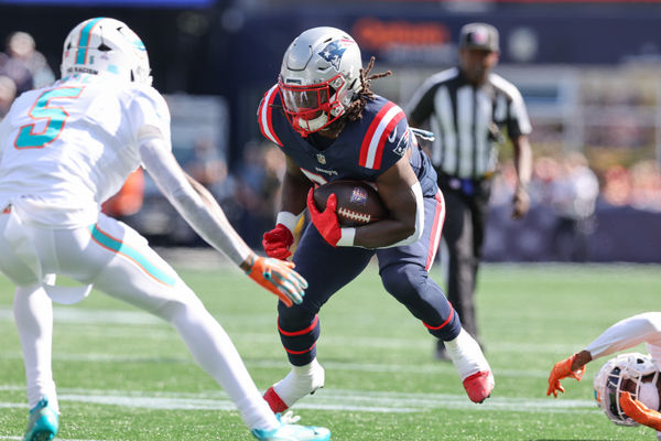 Oct 6, 2024; Foxborough, Massachusetts, USA; New England Patriots running back Rhamondre Stevenson (38) runs the ball during the first half against the Miami Dolphins at Gillette Stadium. Mandatory Credit: Paul Rutherford-Imagn Images