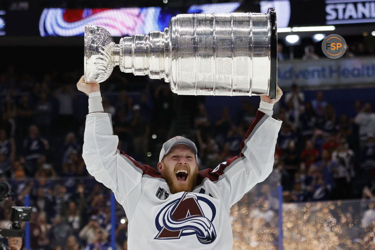 Jun 26, 2022; Tampa, Florida, USA; Colorado Avalanche left wing Gabriel Landeskog (92) celebrates with the Stanley Cup after the game against the Tampa Bay Lightning in game six of the 2022 Stanley Cup Final at Amalie Arena. Credit: Geoff Burke-USA TODAY Sports