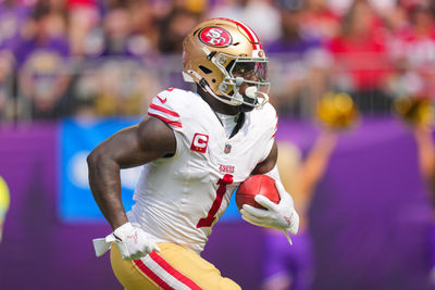 Sep 15, 2024; Minneapolis, Minnesota, USA; San Francisco 49ers wide receiver Deebo Samuel Sr. (1) runs back a kick against the Minnesota Vikings in the first quarter at U.S. Bank Stadium. Mandatory Credit: Brad Rempel-Imagn Images