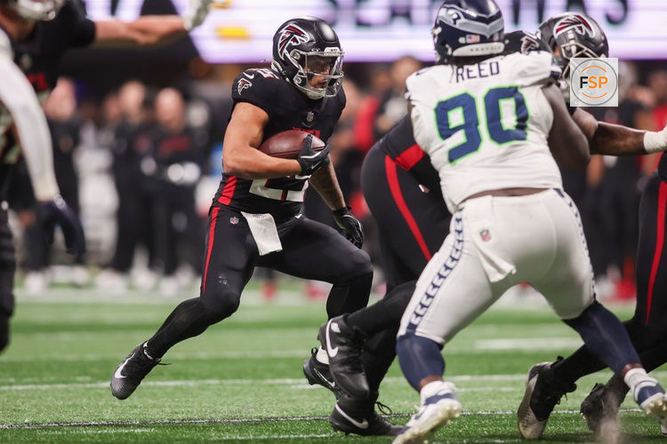 Dec 7, 2025; Atlanta, Georgia, USA; Atlanta Falcons running back Tyler Allgeier (25) runs the ball against the Seattle Seahawks in the fourth quarter at Mercedes-Benz Stadium. Credit: Brett Davis-Imagn Images
