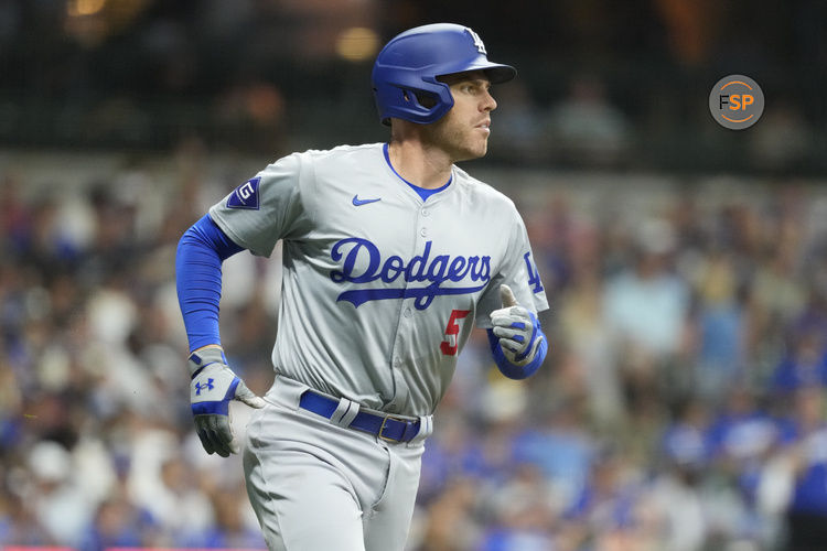 Aug 13, 2024; Milwaukee, Wisconsin, USA;  Los Angeles Dodgers first baseman Freddie Freeman (5) runs towards first base during the seventh inning against the Milwaukee Brewers at American Family Field. Credit: Jeff Hanisch-USA TODAY Sports