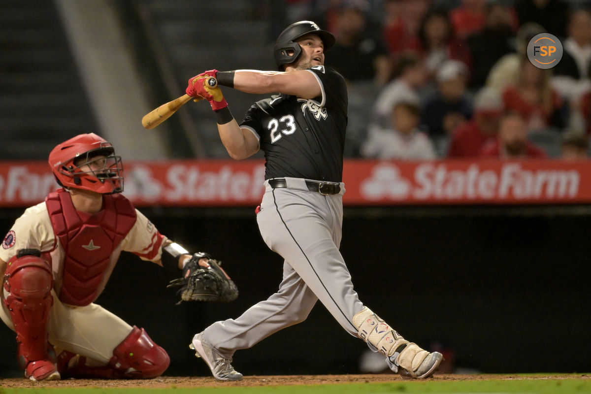 Sep 16, 2024; Anaheim, California, USA;  Chicago White Sox left fielder Andrew Benintendi (23) hits his second home run of the game, a solo shot, in the seventh inning against the Los Angeles Angels at Angel Stadium. Credit: Jayne Kamin-Oncea-Imagn Images