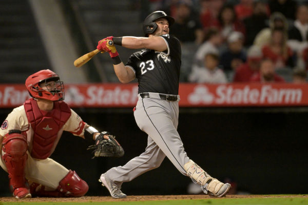 Sep 16, 2024; Anaheim, California, USA;  Chicago White Sox left fielder Andrew Benintendi (23) hits his second home run of the game, a solo shot, in the seventh inning against the Los Angeles Angels at Angel Stadium. Mandatory Credit: Jayne Kamin-Oncea-Imagn Images