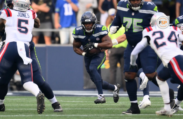 Sep 9, 2026; Seattle, Washington, USA;  Seattle Seahawks running back Jadarian Price (8) runs against the New England Patriots during the 1st quarter at Lumen Field.  Credit: Steven Bisig-Imagn Images