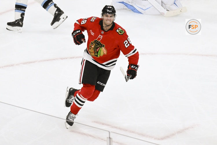 Oct 13, 2025; Chicago, Illinois, USA;  Chicago Blackhawks left wing Andre Burakovsky (28) celebrates after he scores past Utah Mammoth goaltender Vitek Vanecek (41) during the third period at United Center. Credit: Matt Marton-Imagn Images