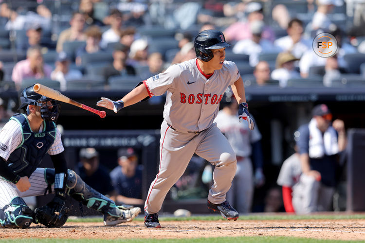 Sep 14, 2024; Bronx, New York, USA; Boston Red Sox designated hitter Masataka Yoshida (7) follows through on a two run single against the New York Yankees during the fifth inning at Yankee Stadium. Credit: Brad Penner-Imagn Images