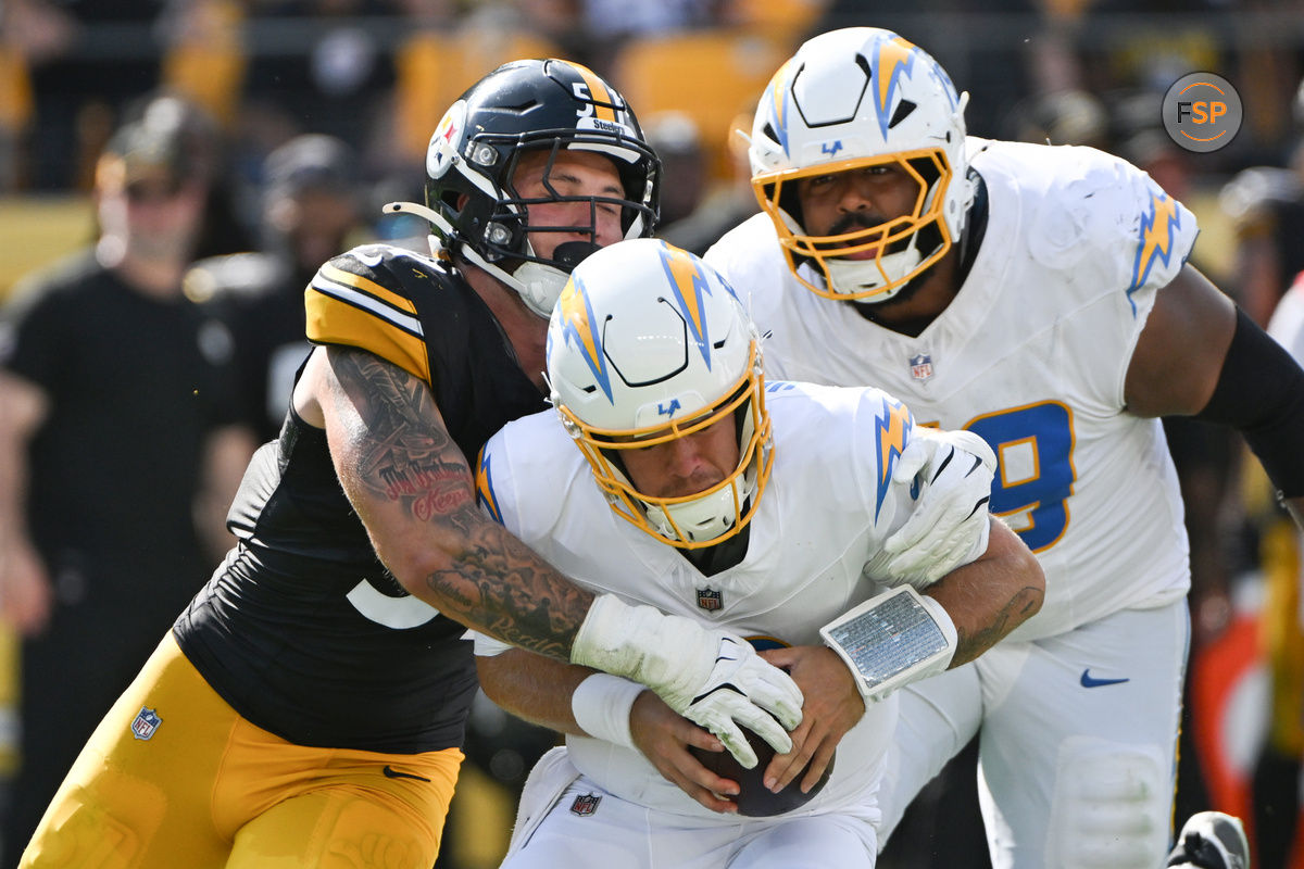 Sep 22, 2024; Pittsburgh, Pennsylvania, USA; Pittsburgh Steelers linebacker Nick Herbig (51) sacks Los Angeles Chargers quarterback Taylor Heinicke (8) during the third quarter at Acrisure Stadium. Credit: Barry Reeger-Imagn Images