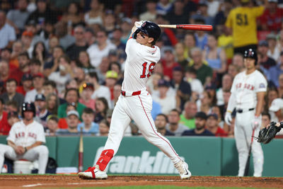 Jul 7, 2025; Boston, Massachusetts, USA; Boston Red Sox designated hitter Roman Anthony (19) hits a two run home run during the fifth inning against the Colorado Rockies at Fenway Park. Mandatory Credit: Paul Rutherford-Imagn Images