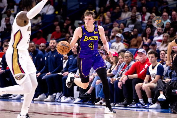 Nov 16, 2024; New Orleans, Louisiana, USA; Los Angeles Lakers guard Dalton Knecht (4) brings the ball up court against the New Orleans Pelicans during the first half at Smoothie King Center. Credit: Stephen Lew-Imagn Images